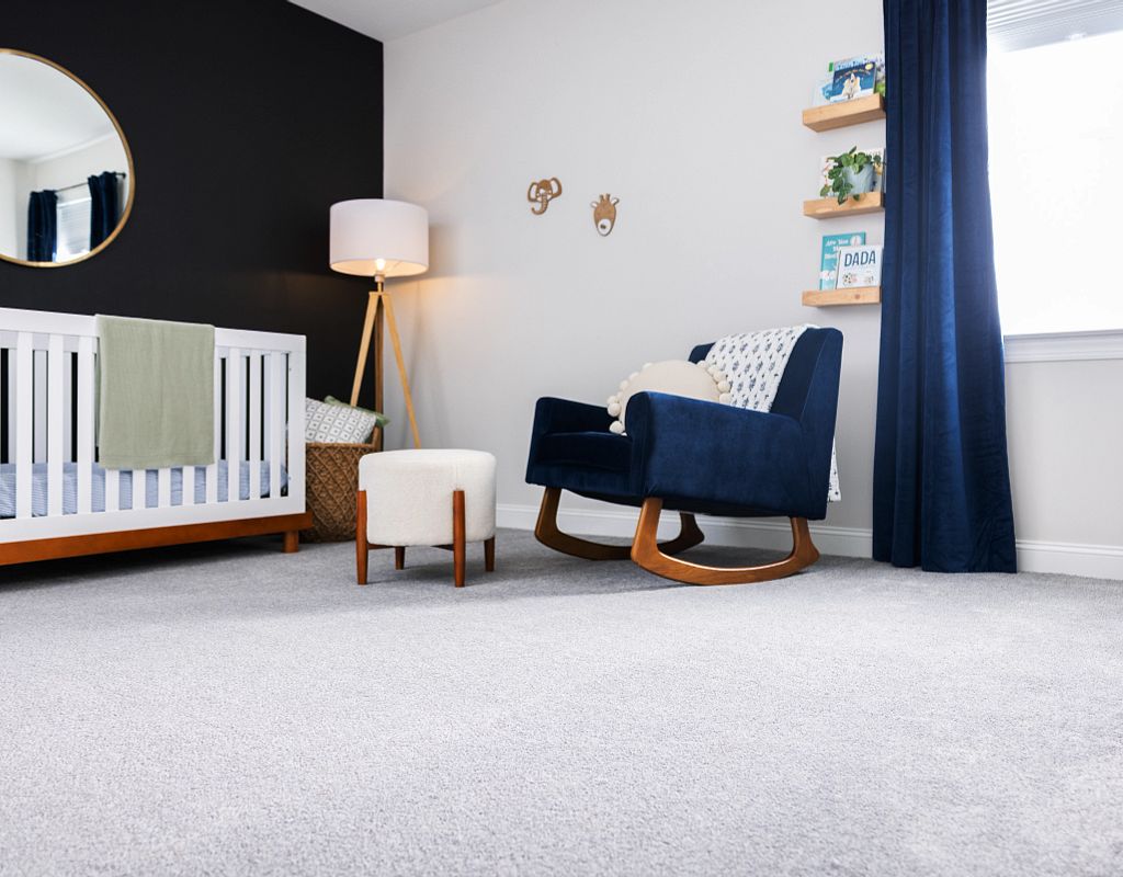 Blue couch on carpet floor | Hopkins Floor Co
