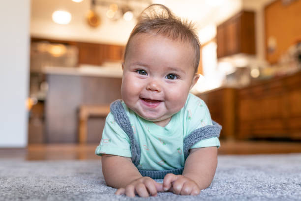 baby on lying carpet floor | Hopkins Floor Co